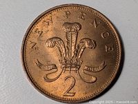Reverse side showing Prince of Wales feathers, denomination 2, legend NEW PENCE