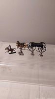Full lineup: horses, wagon, mounted soldier, three foot soldiers