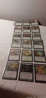 Full binder sheet showing all 18 sleeved cards