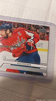 Front view of Alex Ovechkin card in protective sleeve