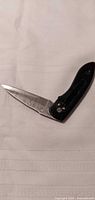 Pocket knife open showing blade and handle