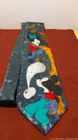 Front view showing full pattern and cartoon character design on tie