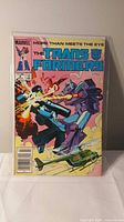 Front cover of Transformers #6 comic in bag and board