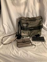 Diesel messenger bag, metallic purse, Guess wallet full lot view