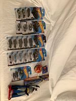 Full lot: 17 Hot Wheels cards, Batman bottle, Superman toothbrush, Superman ornament