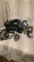 Group shot of docking station, mice, microphone, assorted cables