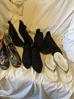 All five pairs displayed together on white drape