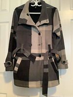 Full front view of plaid fleece coat on hanger