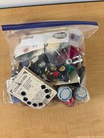 Zipper bag filled with assorted sewing notions and tools