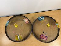 Top view of both mesh covers showing butterfly decorations and overall condition