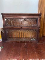 Front view entire bookcase showing two leaded glass doors
