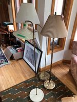 Two floor lamps with shades, showing overall design and condition