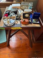 Overall view of stool with jewellery items on top