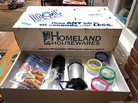 Box showing Magic Bullet branding and contents laid out inside