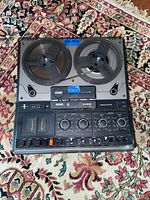 Front view showing full Philips N4504 tape recorder with reels, controls and wear