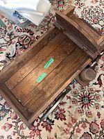 Top view of wooden wagon body showing plank construction and interior