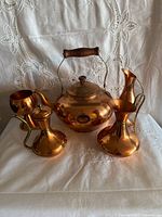 Front view of all five copper pieces