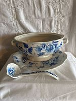 Tureen bowl, underplate, ladle front view