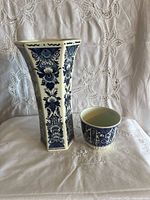 Flared hexagonal vase beside matching bowl showing front decoration