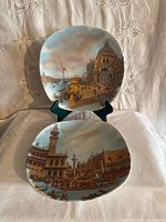 Front view of both plates showing Venetian scenes