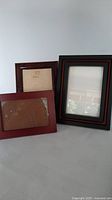 All three wooden frames grouped together