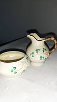Creamer and bowl together showing pattern and form