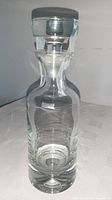 Full view of crystal decanter with stopper
