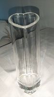 Full view of tall clear crystal vase showing heart cross-section and height