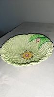 Overall view of moulded poppy-shaped serving bowl