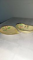 Both Carlton Ware Apple Blossom dishes side by side showing size difference and leaf shapes.