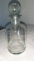 Full view of clear crystal decanter with bubbled stopper