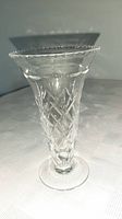 Full view of clear cut crystal vase showing flared rim and foot