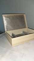 Open jewellery box showing exterior color, interior layout, hinges
