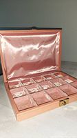 Jewellery box open showing silk interior and compartment layout