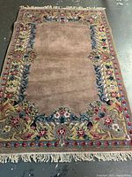 Full view of handmade wool rug with fringe
