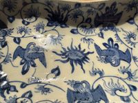 close view of interior showing blue bat and floral design