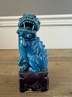 Front view of turquoise glazed Foo Lion figurine