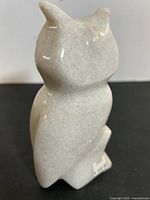 Front angled view of the marble owl showing carved detail and polished surface