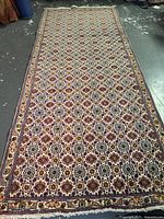 Full view of Persian Moud wool rug showing overall design and borders