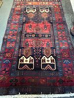 Full view of rug showing overall pattern and fringe