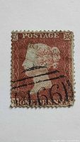 Front of Queen Victoria Penny Red stamp showing design and cancellation