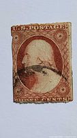 Front of the 3¢ George Washington stamp showing design, cancellation, edge wear