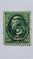 Front of 3¢ green George Washington stamp with cancellation