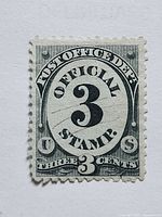 Front of 3¢ official stamp showing design and perforations