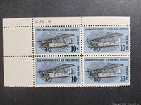 Front view of four-stamp block with margin and plate number