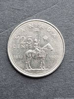 Reverse of coin showing mounted officer, denomination and commemorative dates