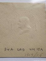 Front view showing embossed Franklin profile stamp without ink, notes on mount