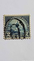 Front of $2 Capitol Building stamp with cancellation