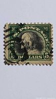 Front of 1918 $5 Benjamin Franklin stamp showing design and cancellation