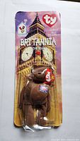 Front view of sealed Britannia bear in carded package